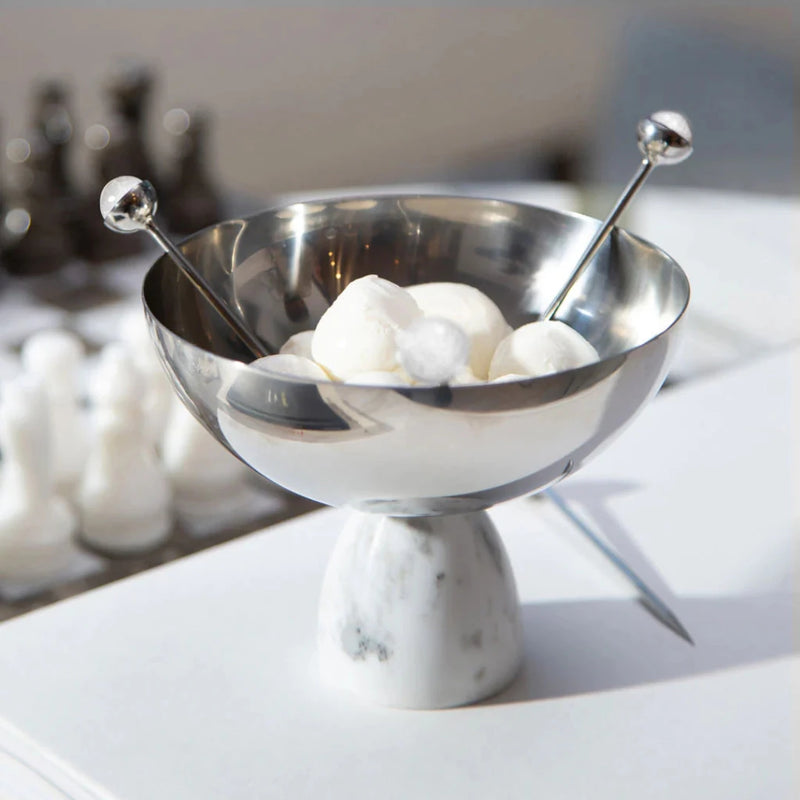 Silver white cystal cocktail picks on a dish.