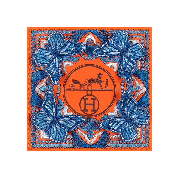 Petite Symmetry HERMES 5x5 artwork featuring embroidered blue butterflies on an upcycled orange HERMES box, framed in acrylic – collectible designer-inspired embroidery art.