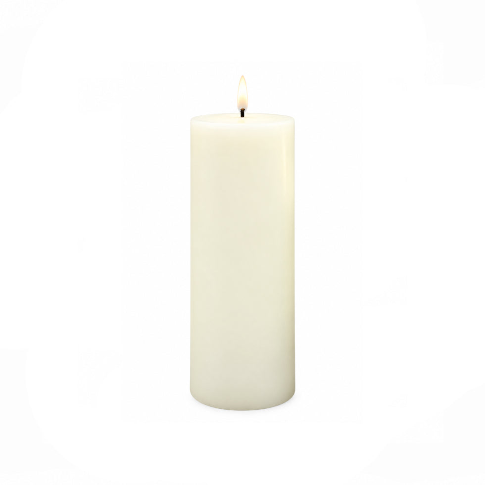 A single lit white pillar candle with a small flame, centered on a plain white background.