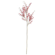 Artificial branch with red berries on a white background