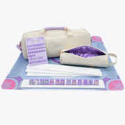 Set of bags and mahjong accessories on a mat with a white background