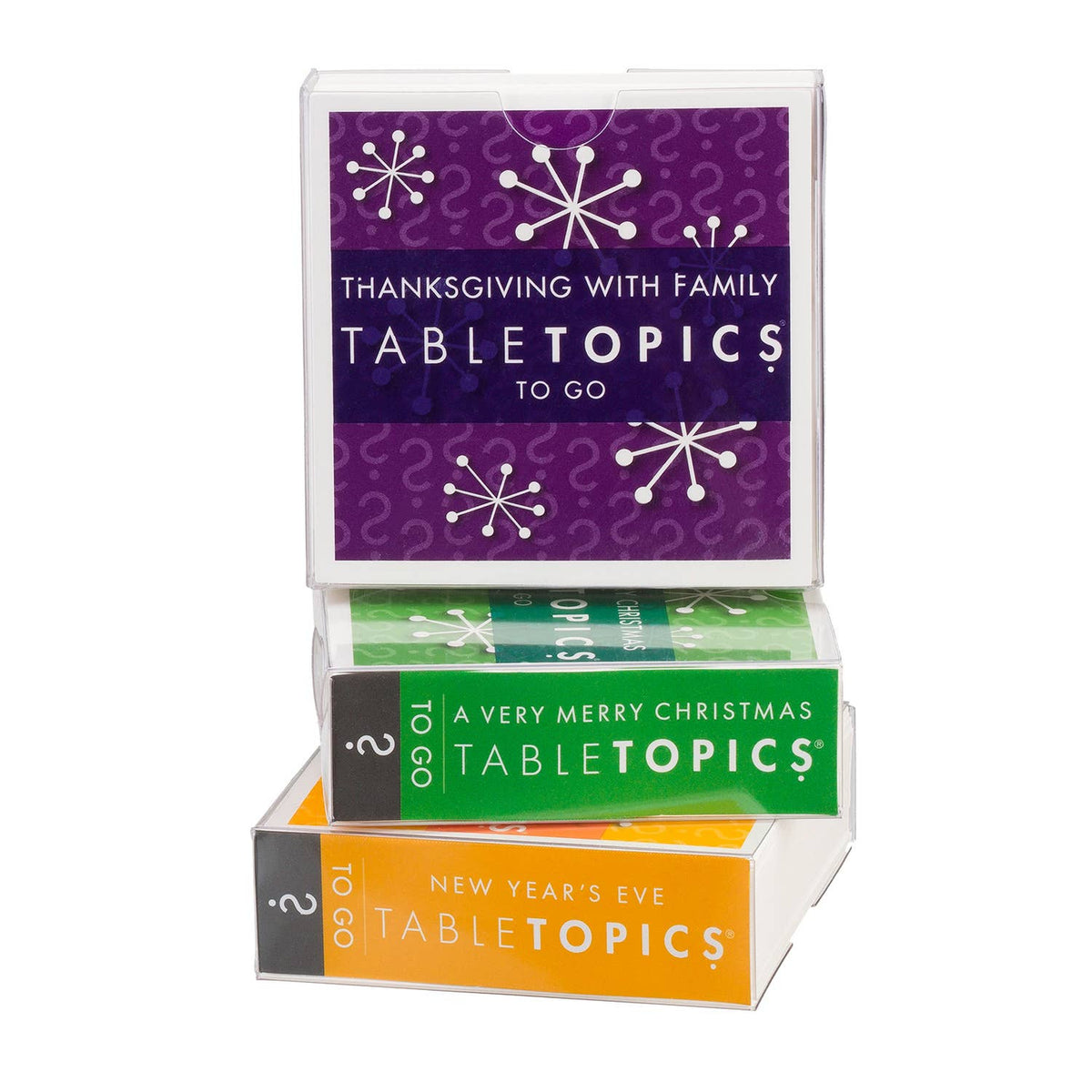 A stack of TableTopics holiday-themed flashcard boxes on a white background. The top box is purple with white snowflake graphics and reads 'Thanksgiving with Family TableTopics to Go.