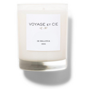 A soy candle in a clear glass jar with a white label reading 'VOYAGE ET CIE est. 201' and 'KYOTO BAMBOO', shown on a white background with a soft shadow.