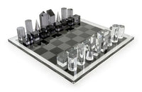 Modern glass chess set on a white background