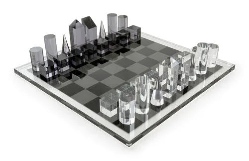 Modern glass chess set on a white background