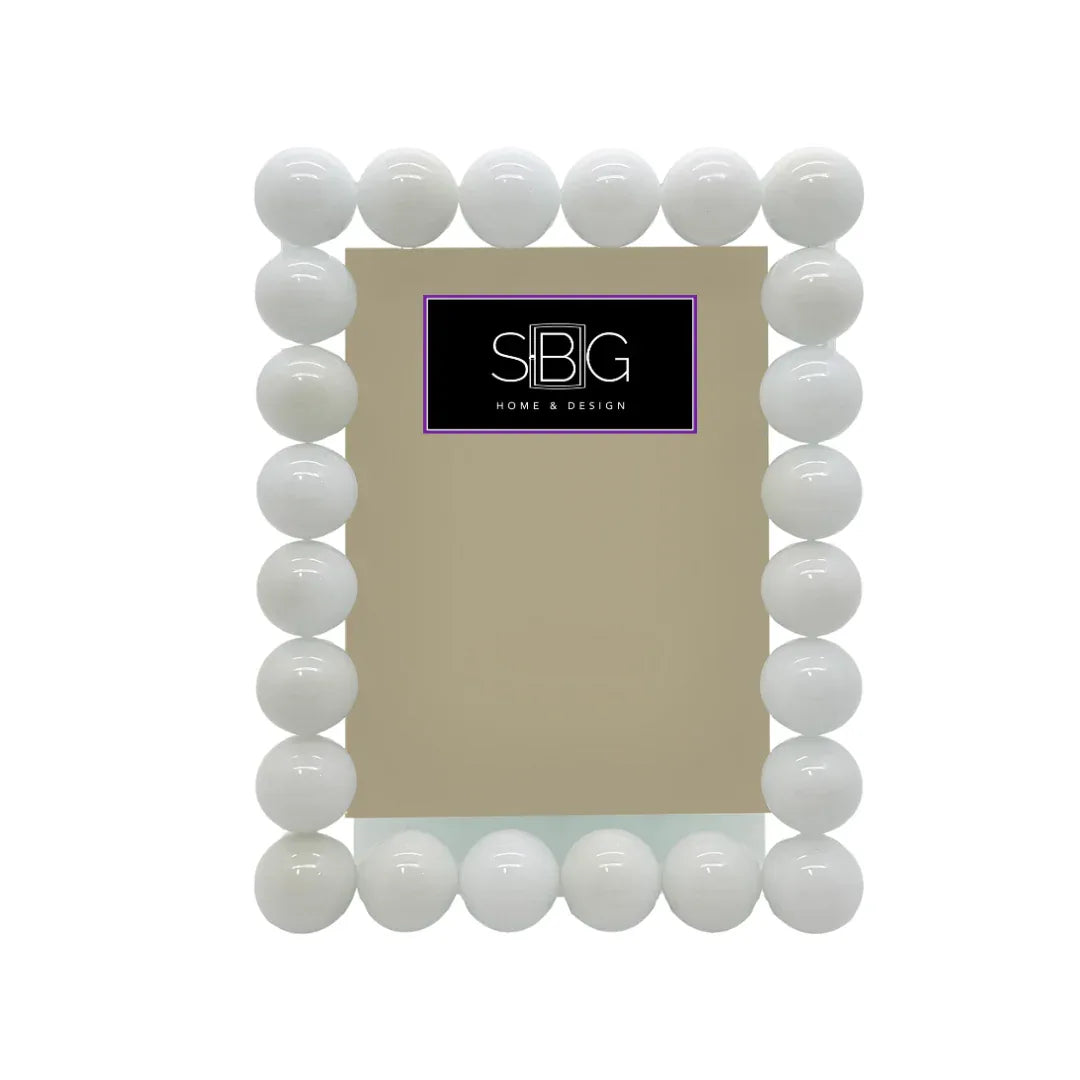White spherical frame with a beige center and visible 'SBG Home & Design' logo.