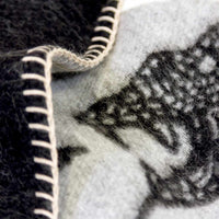 Peyote Rattlesnake Grey/Dark Grey throw with ivory stitching. 