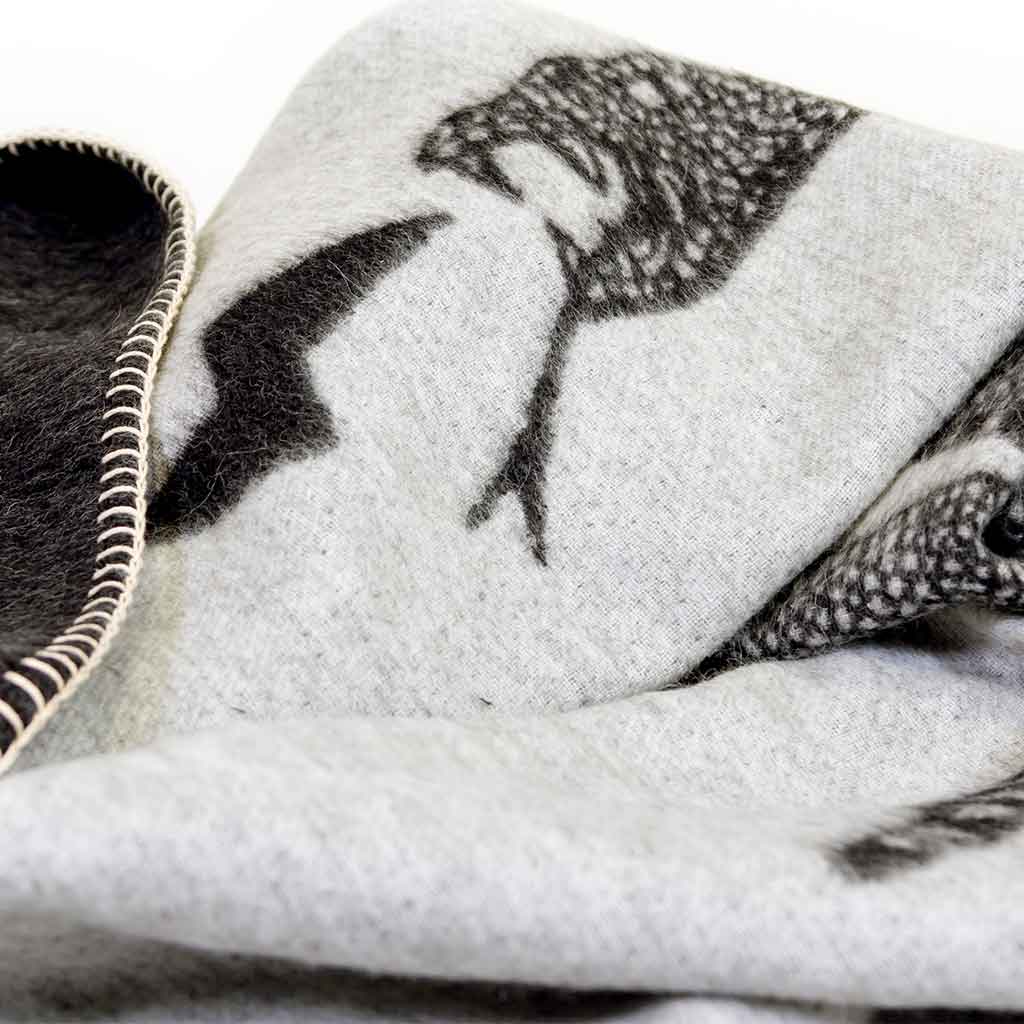 Peyote Rattlesnake Grey/Dark Grey throw with ivory stitching. 