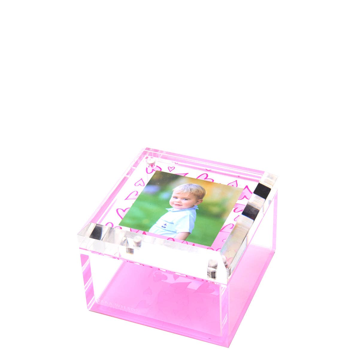 Pink photo frame with a child's picture on a white background with hearts