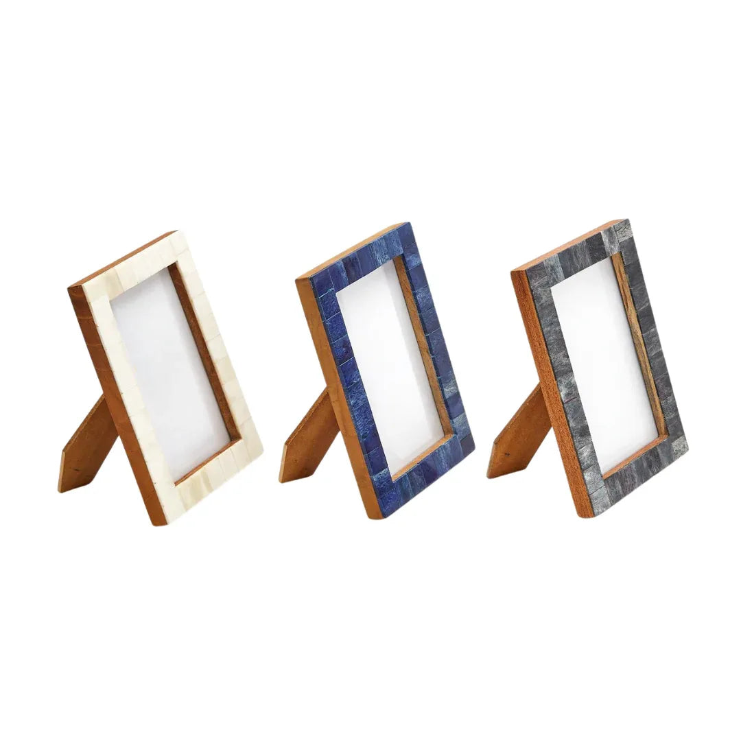 Three wooden Bone Inlay picture frames with different designs on a white background