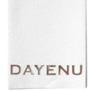 White fabric swatch with 'DAYENU' branding