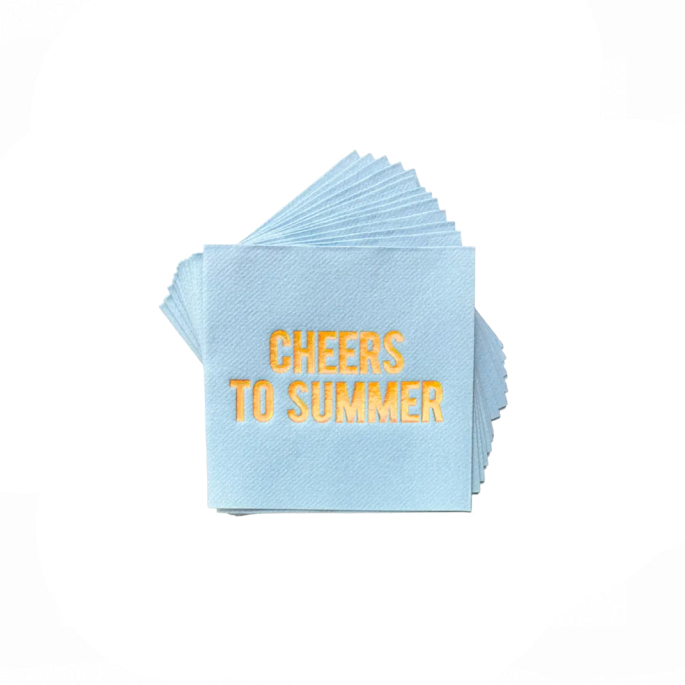A stack of light blue paper cocktail napkins with 'CHEERS TO SUMMER' printed in gold foil lettering, displayed against a solid white background.