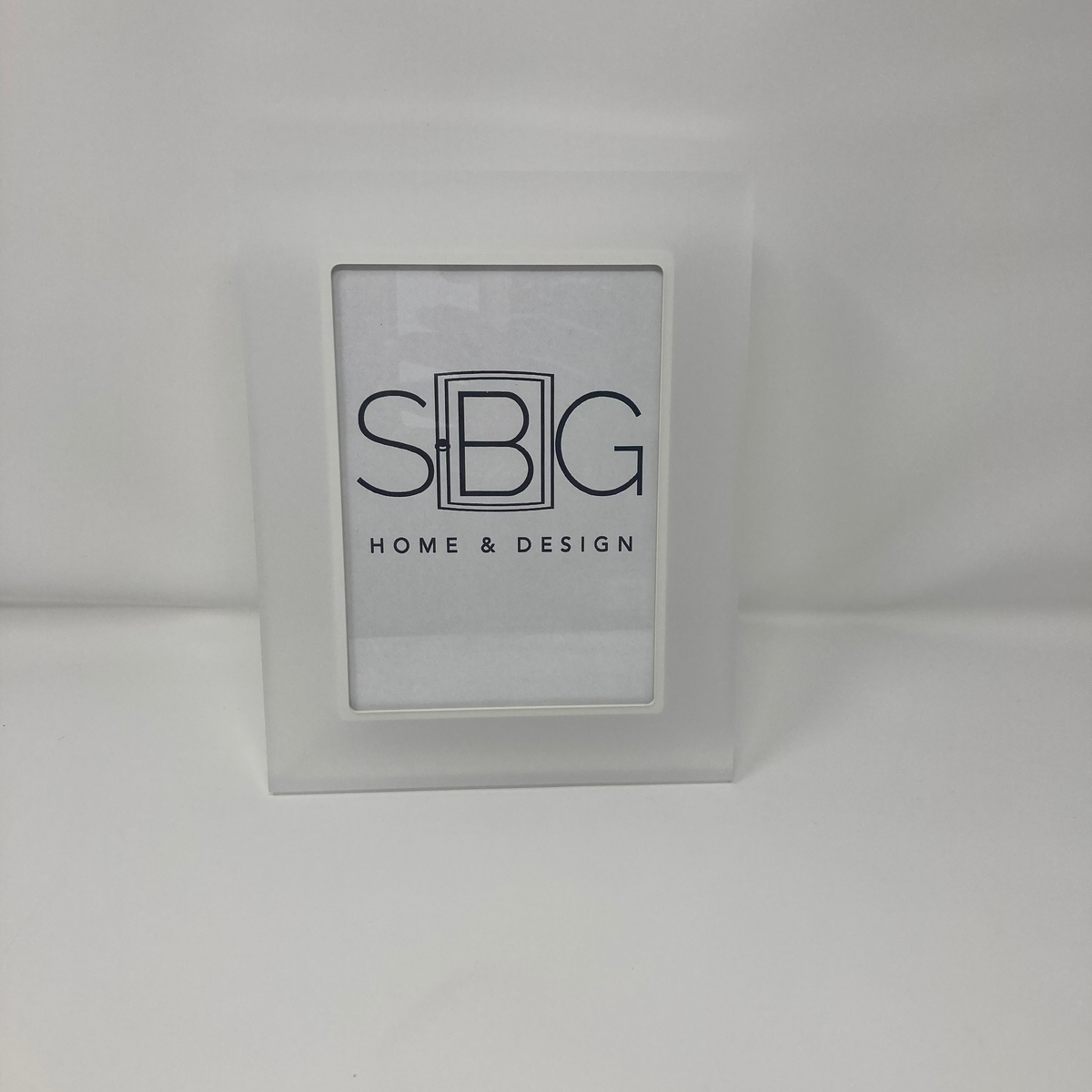 White frame with 'SBIG HOME & DESIGN' logo on a white background