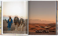 Inside spread of Great Escapes Africa showing a luxury safari lodge at sunset.