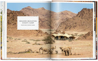 Open book showing a desert landscape with a building and elephants, labeled 'Hoanib Skeleton Coast Camp'.