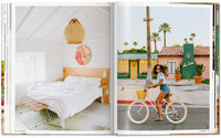 Open book showing two images: a bedroom interior and a woman riding a bike on a street. Great Escapes USA. The Hotel Book Books