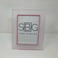 Framed picture with 'SBG Home & Design' logo on a white background