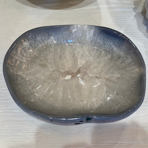 Decorative stone bowl on a textured surface