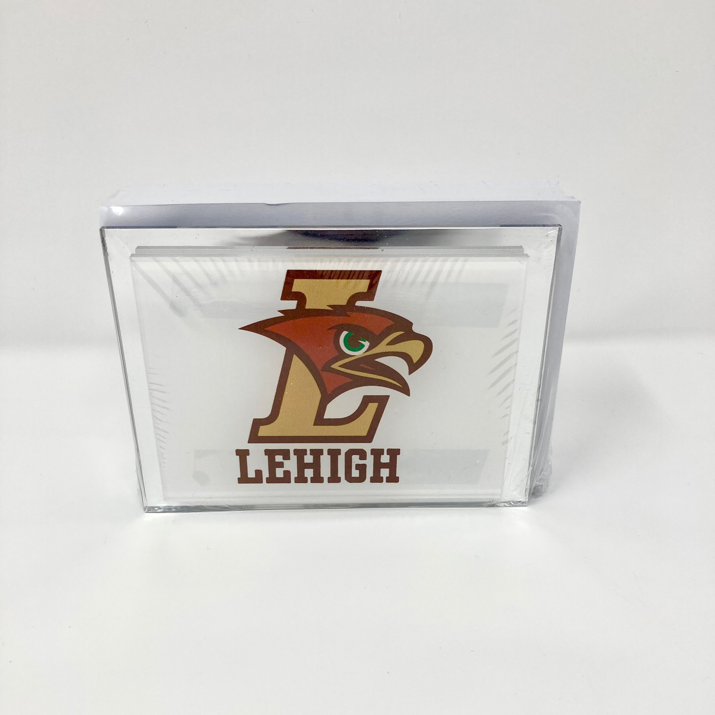 Clear glass block with Lehigh logo on a white background