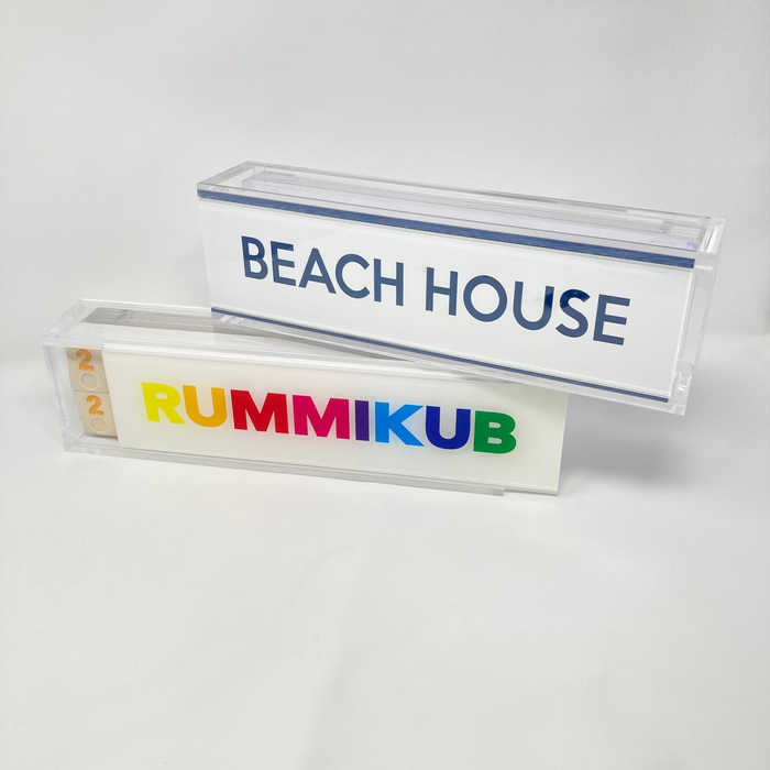 Rummikub game box with 'Beach House' text on a white background