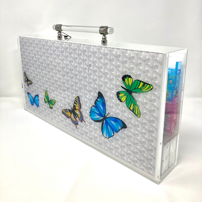 Silver clutch bag with butterfly designs on a white background