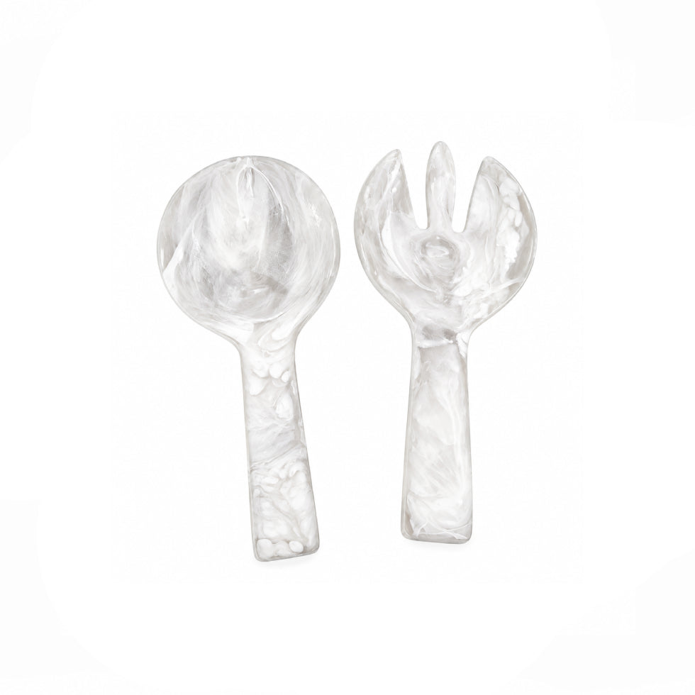 A clear glass serving spoon and matching glass serving fork with a marbled swirl pattern, displayed on a clean white background.