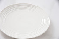 White ceramic plate on a white background