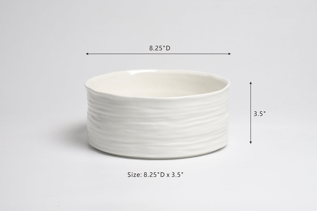 White ceramic bowl with dimensions on a light gray background