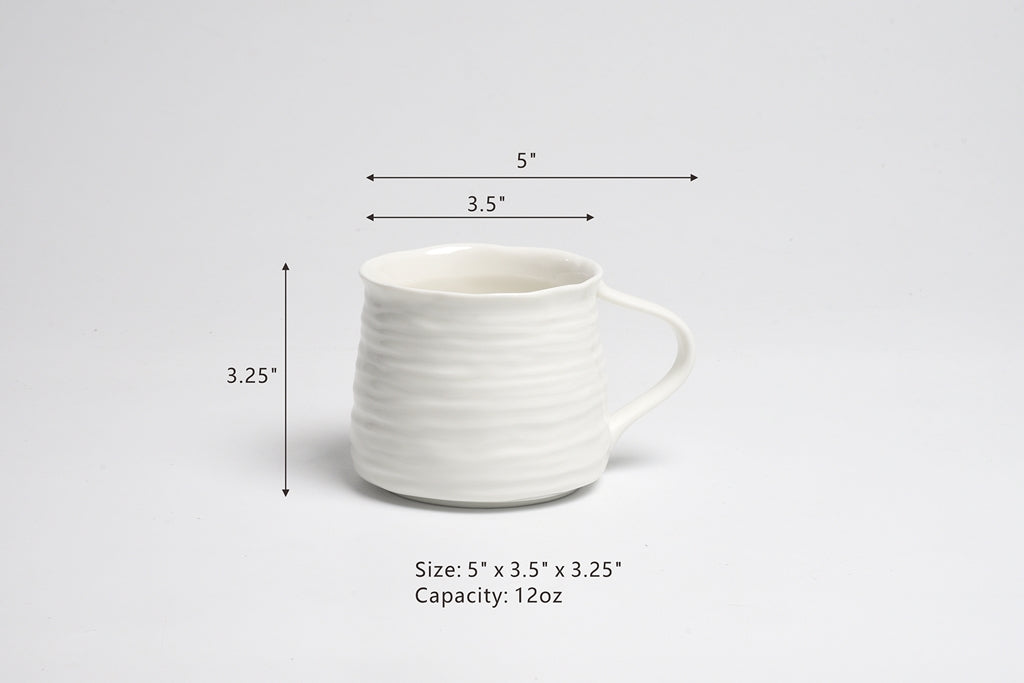 White ceramic mug with dimensions and capacity on a light gray background
