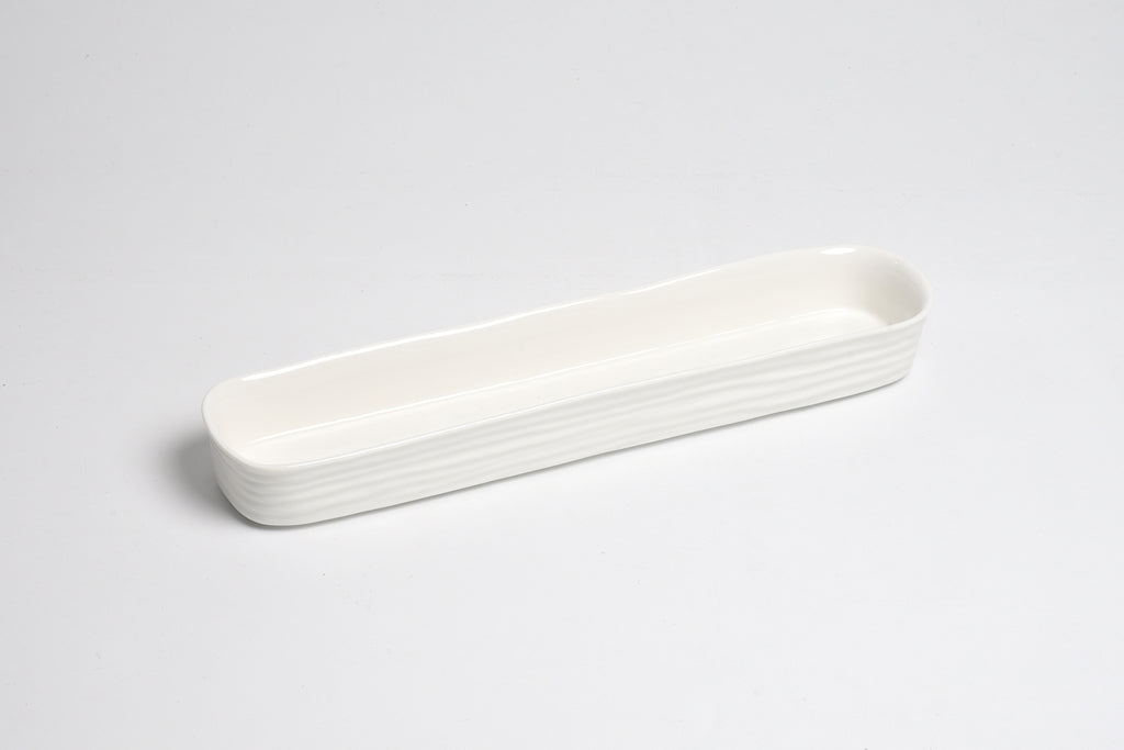 White ceramic tray on a light gray background
