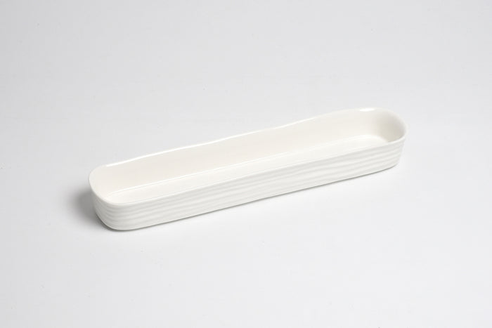 White ceramic tray on a light gray background
