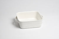 White ceramic rectangular dish on a light gray background
