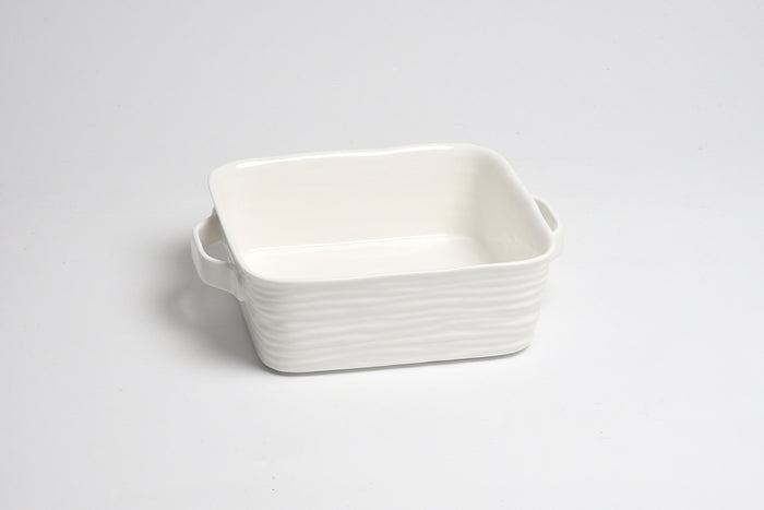 White ceramic rectangular dish on a light gray background