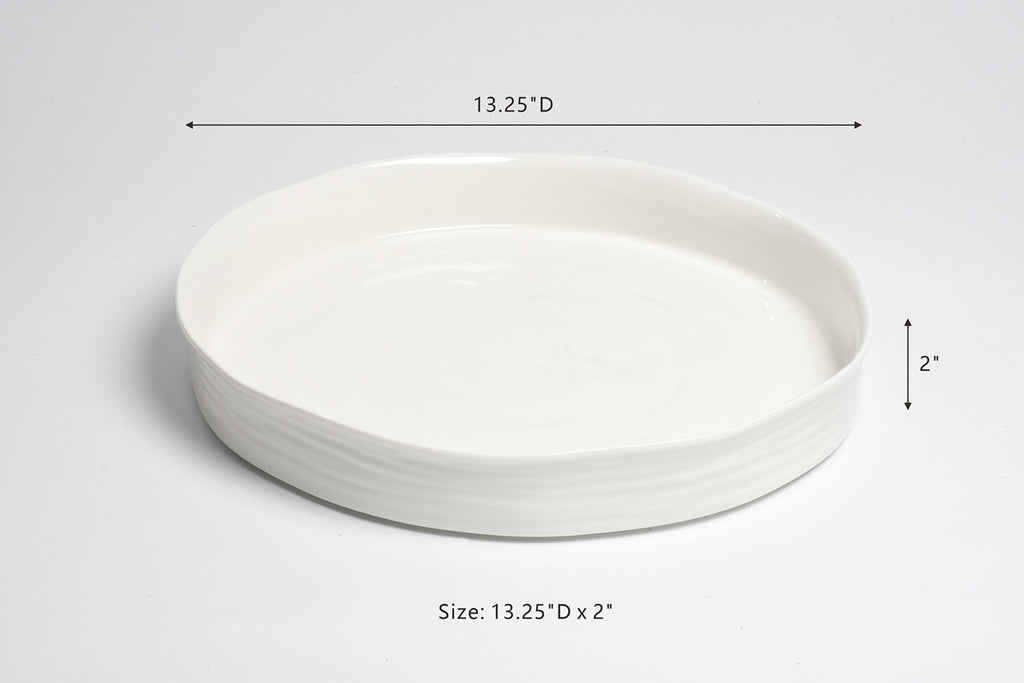 White ceramic dish with dimensions on a light gray background
