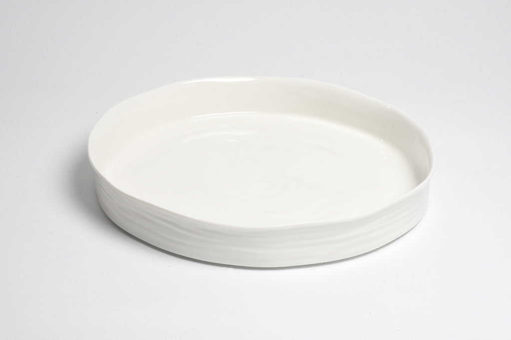 White ceramic plate on a light gray background