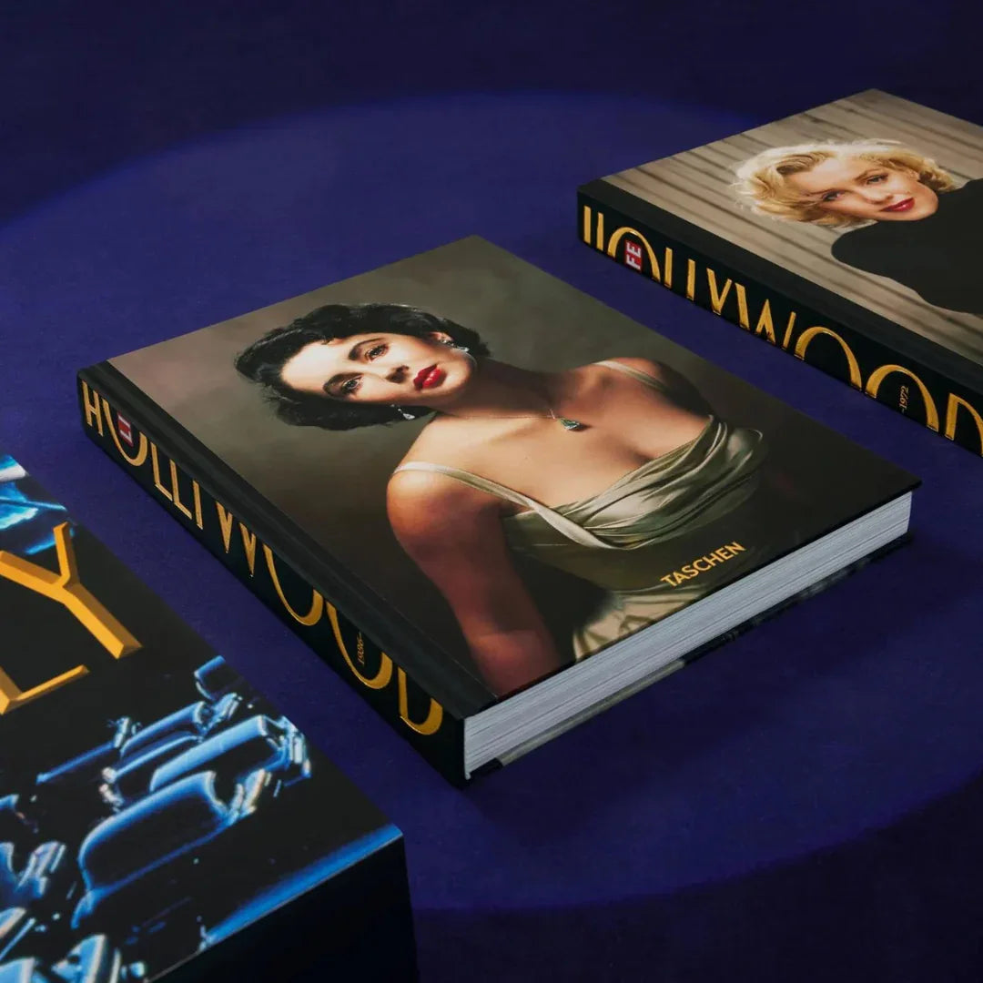 Books with artistic covers on a blue surface