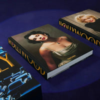 Books with artistic covers on a blue surface