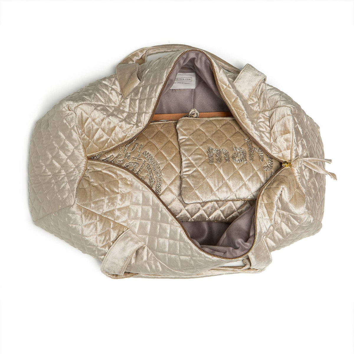 Quilted silver handbag with embroidery on a white background