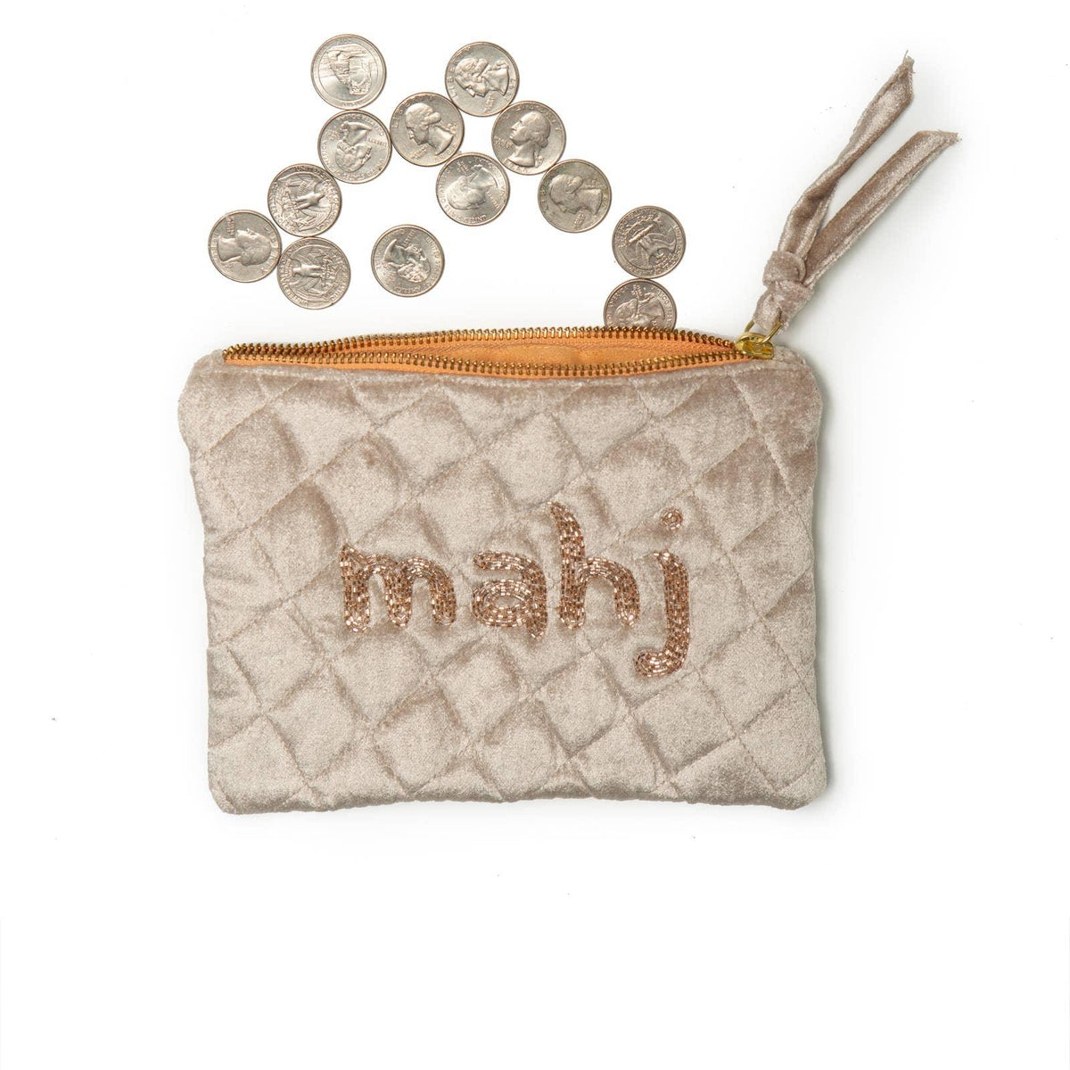 taupe coin purse with 'mahj' embroidery, filled with coins on a white background