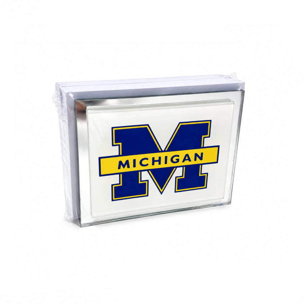 A clear acrylic block sign featuring the Michigan 'M' logo in blue and yellow with 'MICHIGAN' text, shown on a white background.