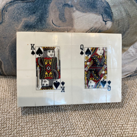 Original Playing cards with King and Queen of Spades on a textured surface