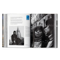 Open book showing black and white photos of people in an urban setting French History Photography, Paris Architecture