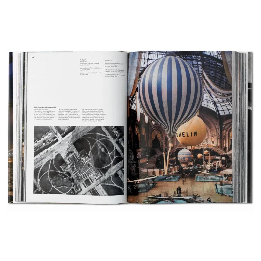 Open book showing a page with a hot air balloon and another with black and white aerial view. Portrait book photography of Paris