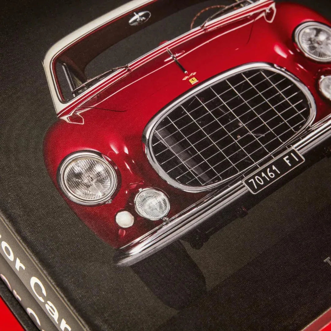 Close-up of a red vintage car model on a black background supercar photography
