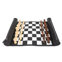 Roll-up chessboard with black and white checkered pattern and wooden chess pieces on a white background