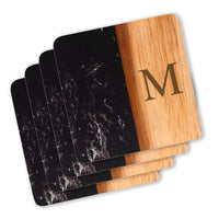 Square Marble & Acacia Wood Coasters in black marble with "M" engraved. 