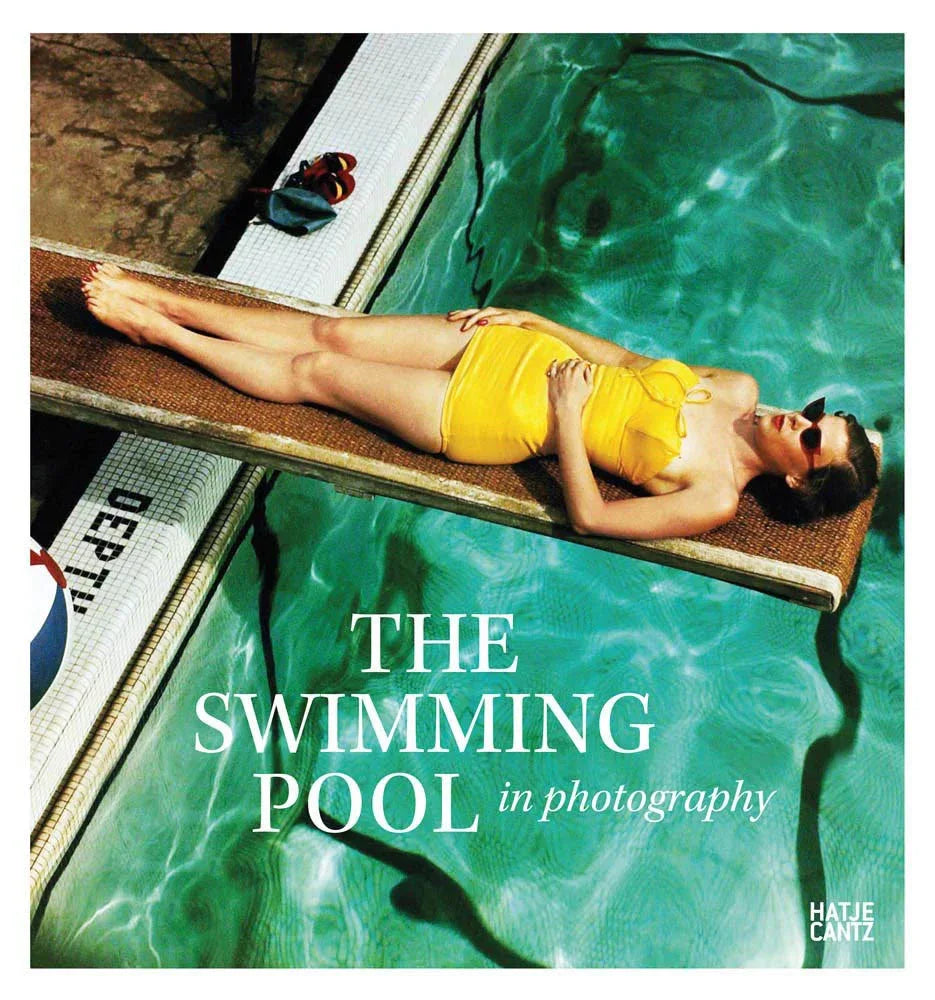 Person in yellow swimsuit lying on a diving board over a pool with 'The Swimming Pool in Photography' text.