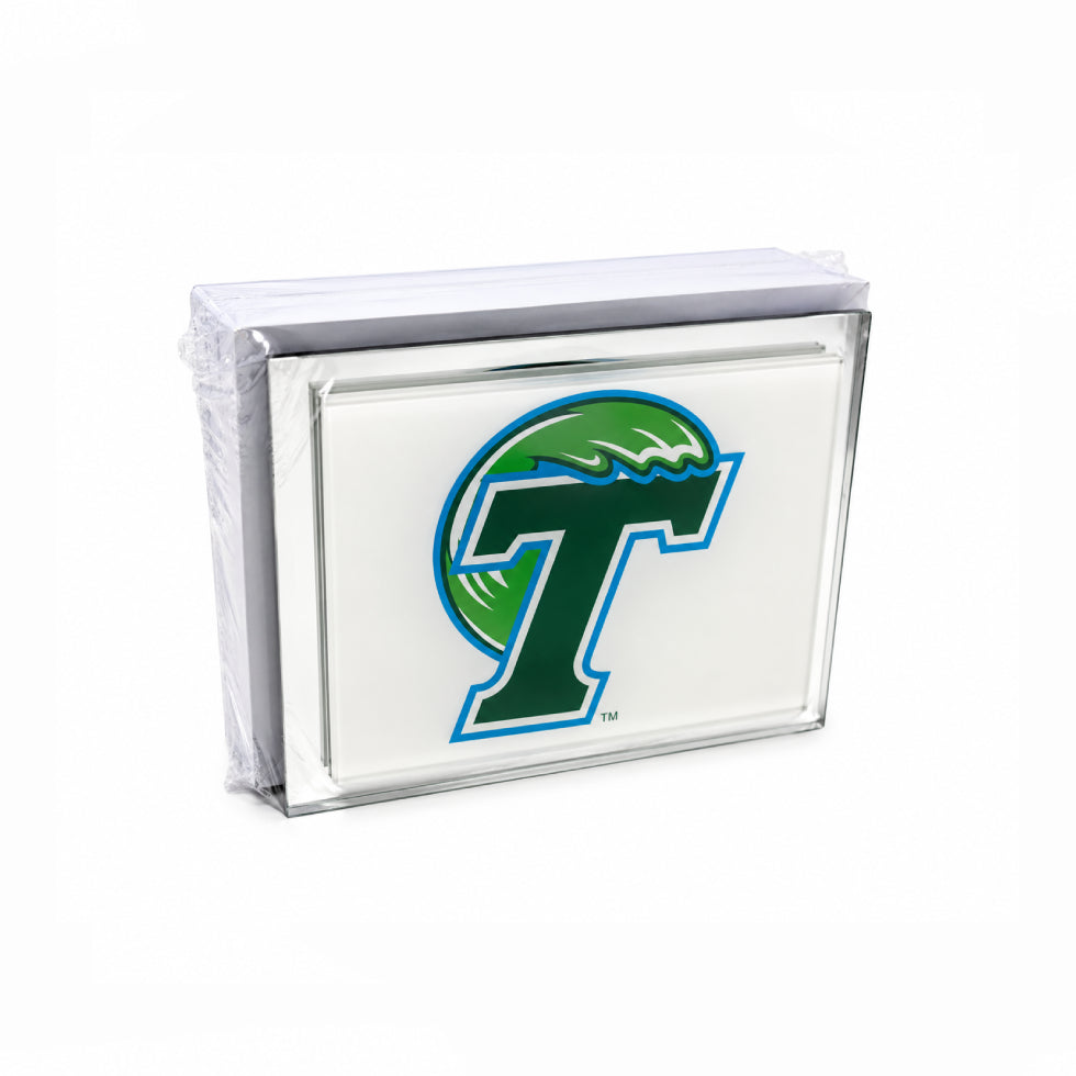 A clear acrylic block sign featuring the green and blue Texas Tech Red Raiders logo on a white background, wrapped in protective plastic on a white studio background.