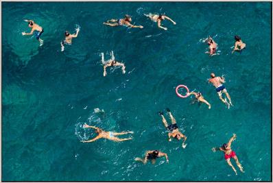 People swimming in a pool from an aerial perspective