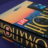 Stack of books titled 'Hollywood' with a 'LIFE' logo on a blue background